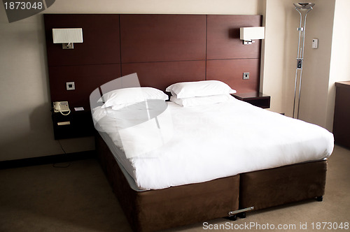 Image of King sized bed in a suite