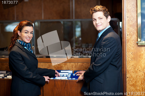 Image of Casual shot of young help desk executives checking customer records