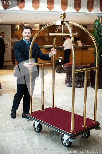 Image of Casual shot of a concierge pushing the cart