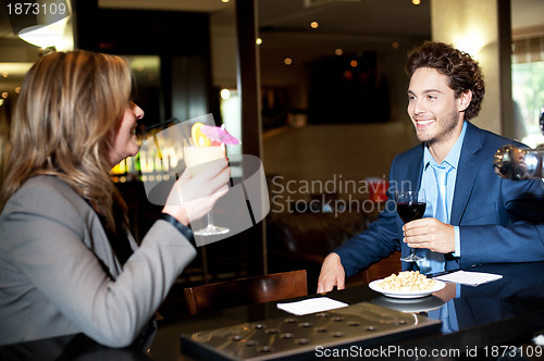 Image of Friends enjoying cocktail at the bar