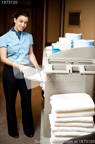 Image of Housekeeping in charge pulling out the bath towel