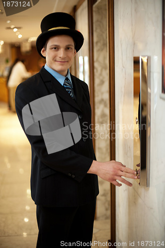 Image of Profile shot of a doorman in bowler hat