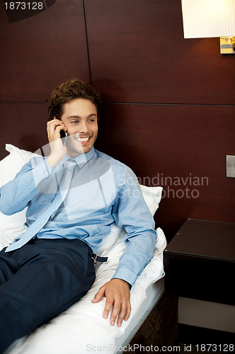 Image of Relaxed cool guy talking on the phone