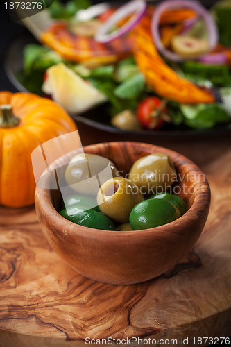 Image of Delicious green olives with salad