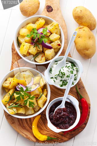 Image of Baked potatoes with chutney and sour cream