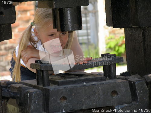 Image of Hand under the stamping press