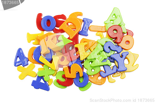 Image of 	Plastic alphabet letters stacked on a white background