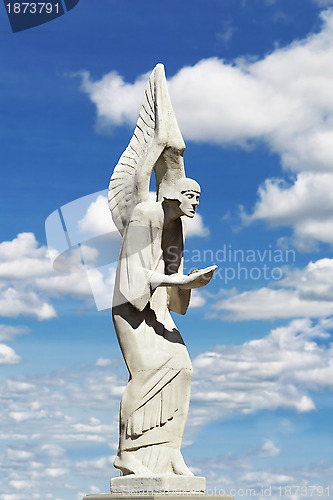 Image of 	Angel statue on a blue sky background