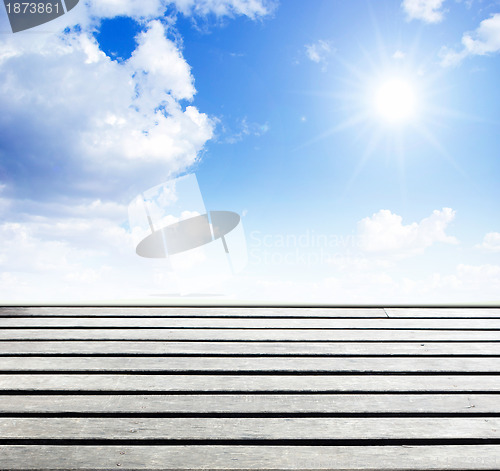 Image of blue sky and wood floor background