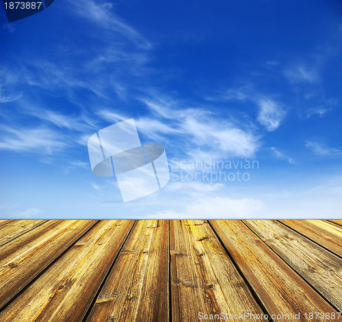 Image of blue sky and wood floor background