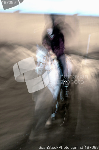 Image of Female rider in motion.