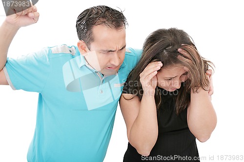 Image of Terrified abused woman trying to stop the attack and defend hers