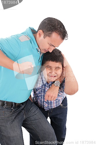 Image of Young boy being aggressively held up by his father 