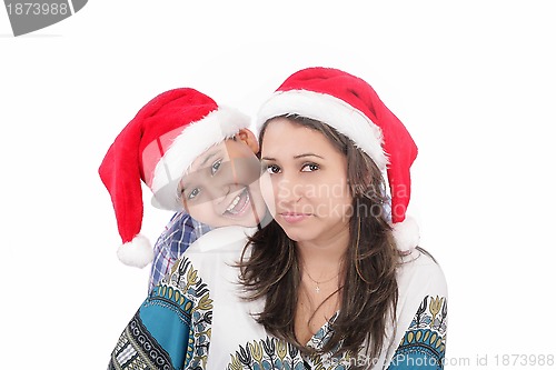 Image of Cheerful boy and woman in Santa Claus hat. Isolated on white bac