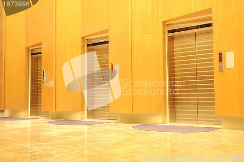 Image of Three elevator doors in new office building 