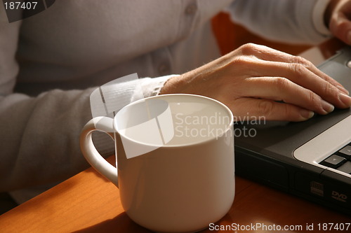 Image of working on a laptop