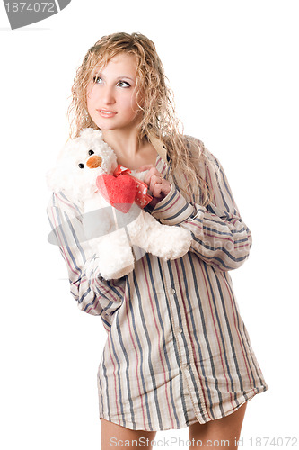 Image of Thoughtful blonde holding teddy bear