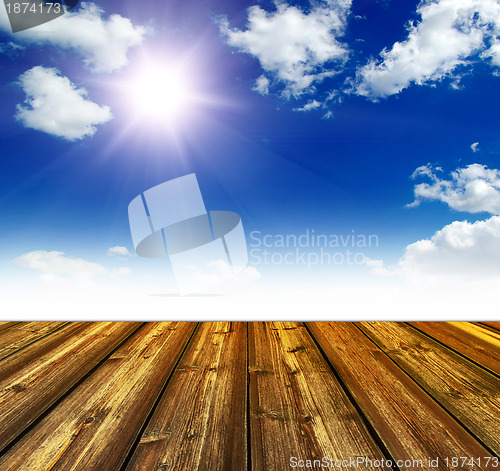 Image of blue sky and wood floor background