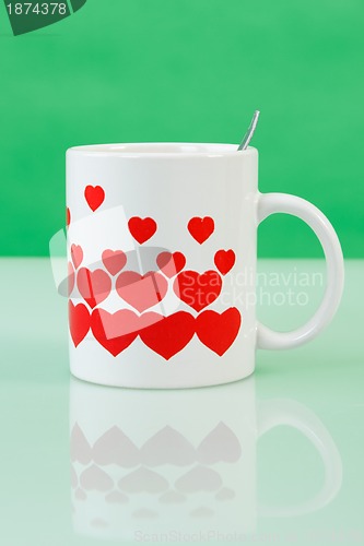 Image of White cup with red hearts