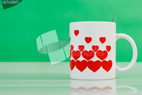 Image of White cup with red hearts