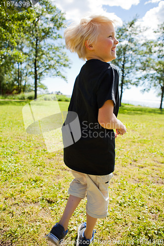 Image of Boy jumping outdoors