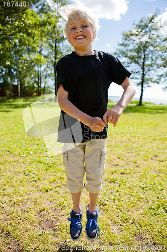 Image of Boy jumping outdoors