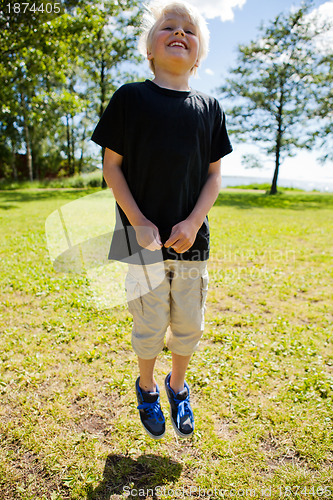 Image of Boy jumping outdoors
