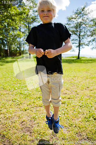 Image of Boy jumping outdoors