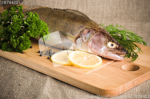 Image of Pike perch on a wooden kitchen board