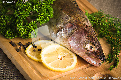 Image of Pike perch on a wooden kitchen board