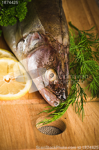 Image of Pike perch on a wooden kitchen board