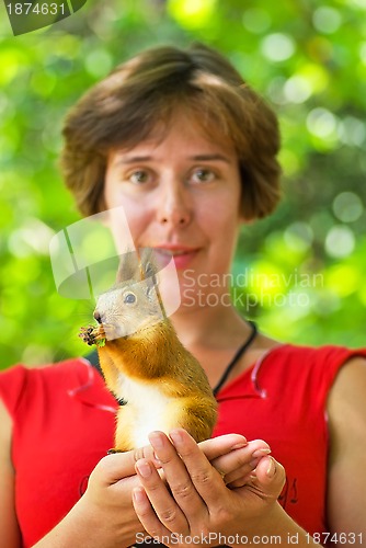 Image of Young woman and squirrel