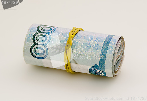 Image of Roll of money fixed with rubber band