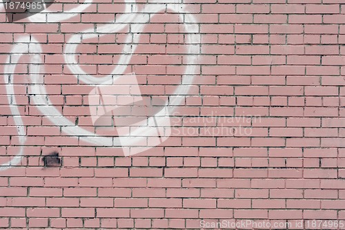 Image of pink painted brick wall