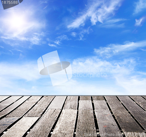 Image of blue sky and wood floor background