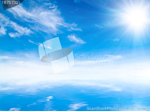 Image of white fluffy clouds with rainbow in the blue sky