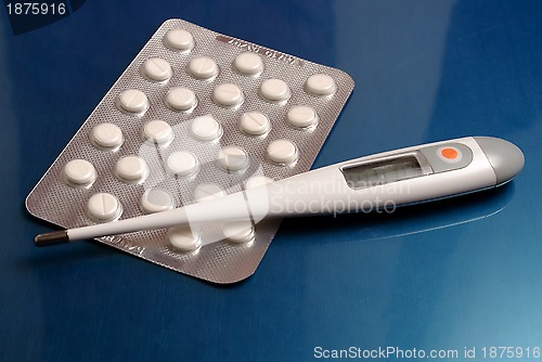 Image of Thermometer and pills