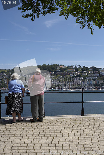 Image of elderly couple looking towards kingswear