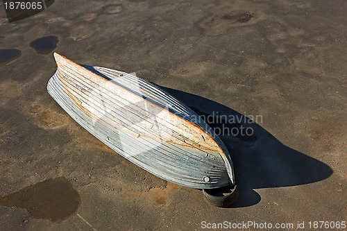 Image of Wooden boat inverted bottom up