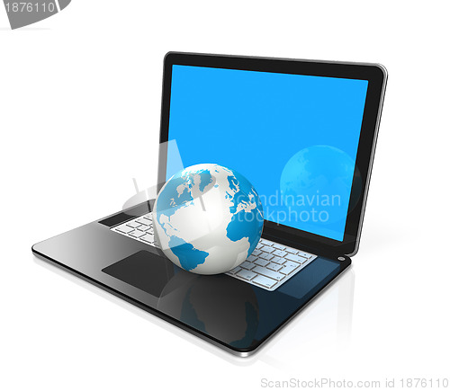 Image of World globe, map on a laptop