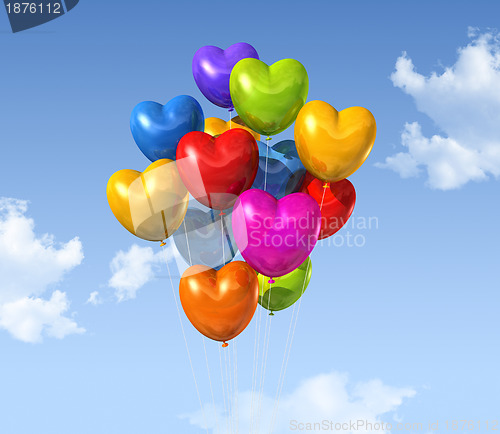 Image of colored heart shape balloons on a blue sky