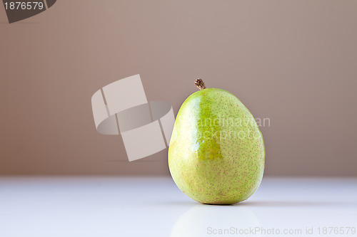 Image of Green Pear on White with Brown Background