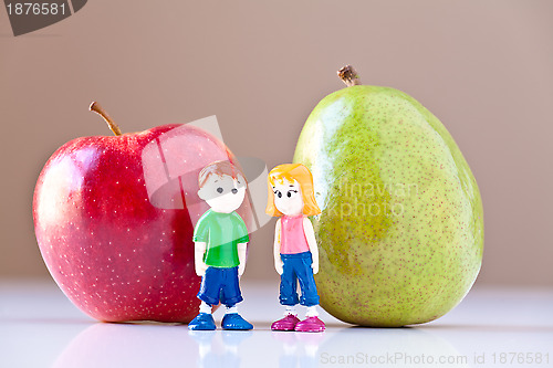 Image of Girl and Boy Discussing Healthy Nutrition (Pear and Apple)