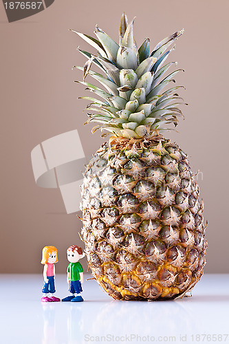 Image of Girl and Boy Discussing Healthy Nutrition (Pineapple)