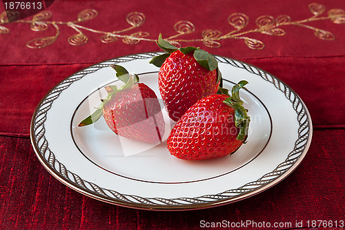 Image of Three Strawberries on a Plate