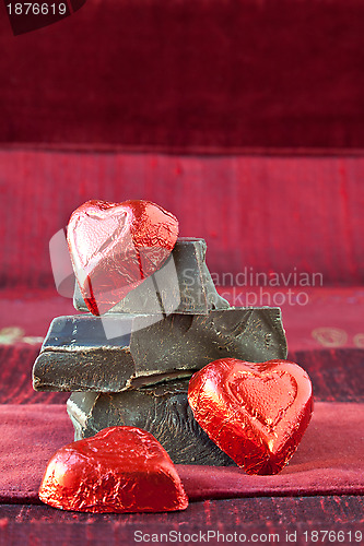 Image of Candy Hearts on a Pile of Dark Chocolate Pieces