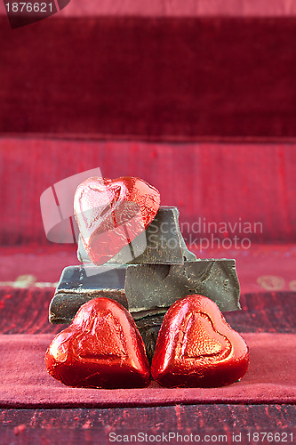 Image of Candy Hearts on a Pile of Dark Chocolate Pieces