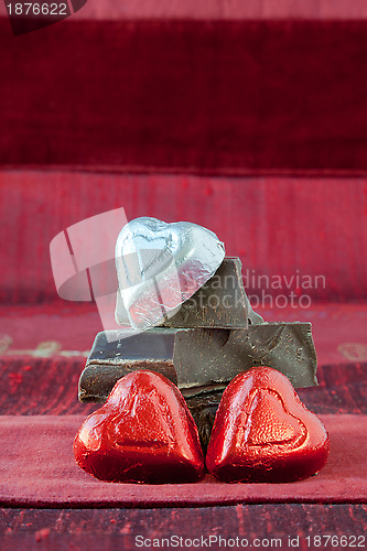 Image of Candy Hearts on a Pile of Dark Chocolate Pieces