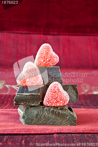 Image of Candy Hearts on a Pile of Dark Chocolate Pieces