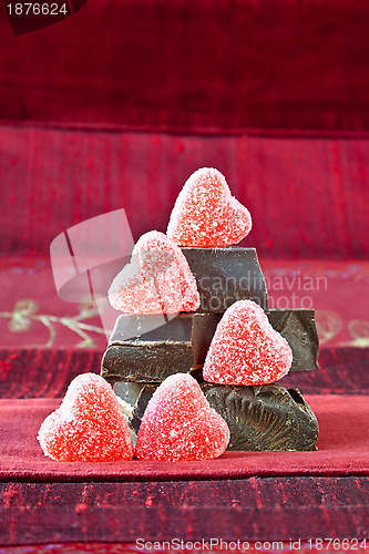Image of Candy Hearts on a Pile of Dark Chocolate Pieces